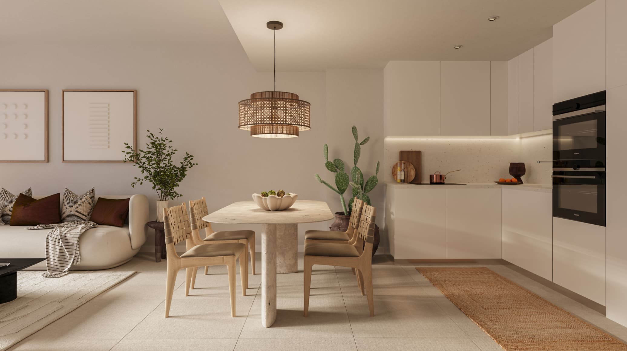 COCINA-HR-1 - MiraCasa Open-plan kitchen and dining area with a round stone table, beige chairs, and a woven pendant light overhead.