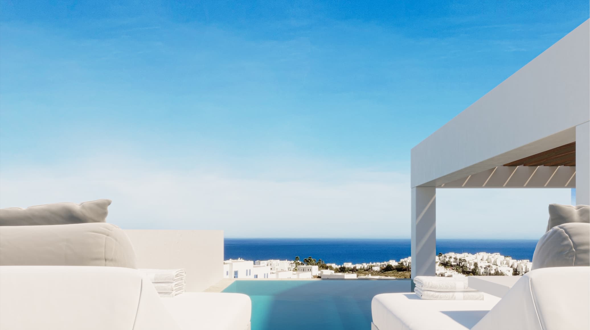 Contemporaneo_roof_002 - MiraCasa White outdoor lounge area with cushions and a pool, overlooking a blue ocean under a clear sky. A modern white structure sits on the right.