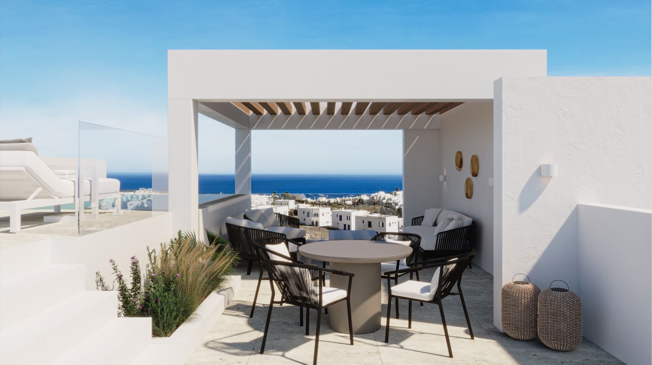 Contemporaneo_roof_003 - MiraCasa Open-air seating area with a round table and black chairs under a wooden pergola, white walls, and a sea view.