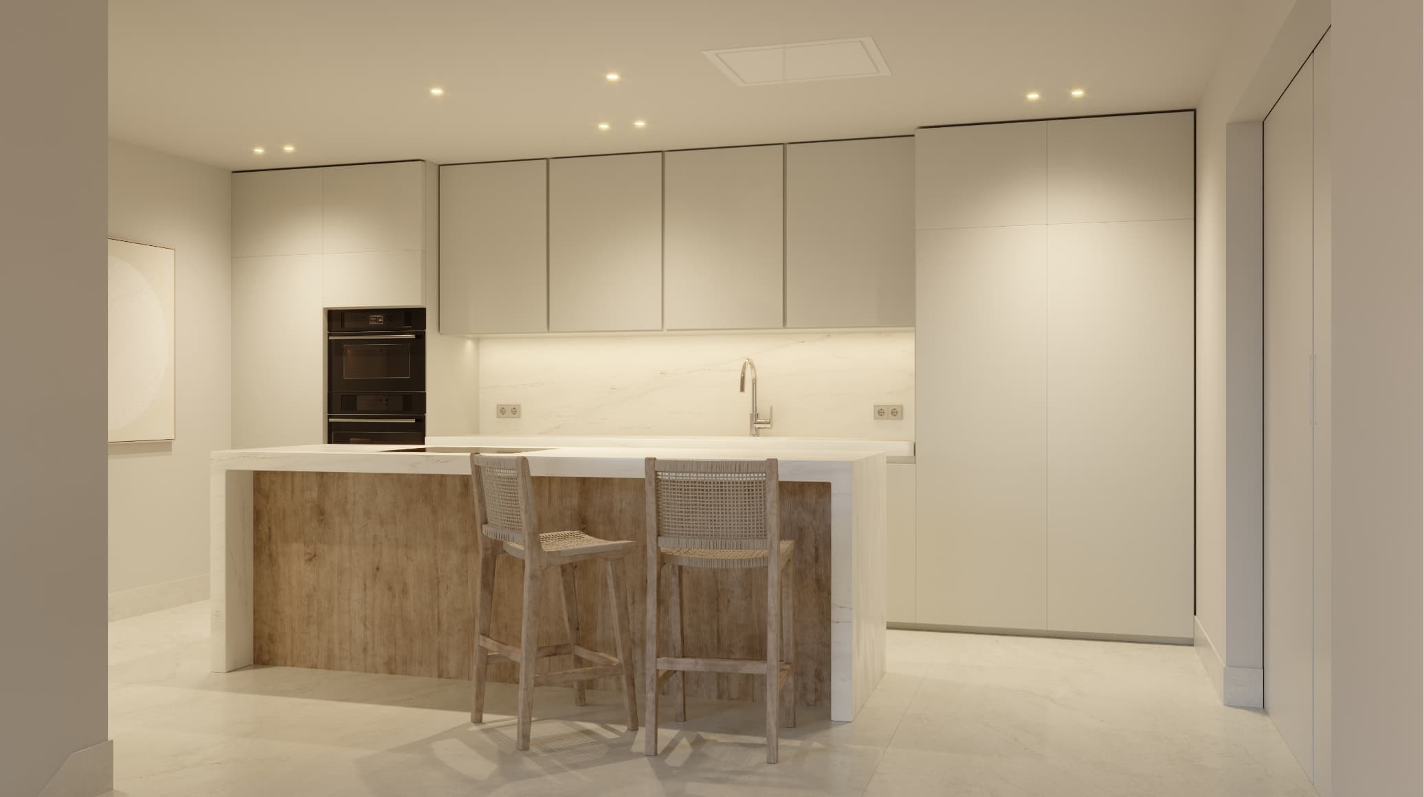 Natural_cocina - MiraCasa Modern white kitchen with marble backsplash, wooden island, and two wicker bar stools.