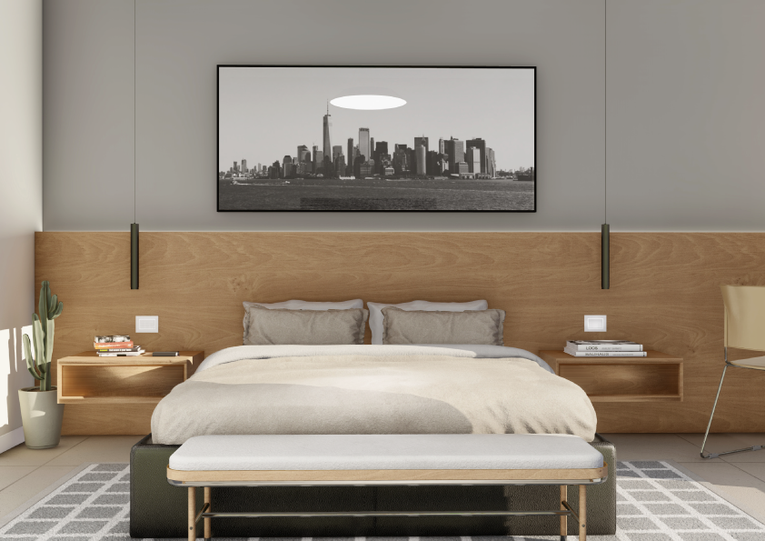 Oasis-Los-Pinos-II-Inalgra-Huercal-de-Almería-10 - MiraCasa Modern bedroom with a king bed, gray bedding, a wooden headboard, a black-and-white city skyline art piece, and a bench at the foot of the bed.