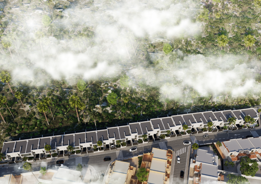 Oasis-Los-Pinos-II-Inalgra-Huercal-de-Almería-2 - MiraCasa Aerial view of a residential street lined with townhouses, with a dense forest beyond and wispy fog over the treetops.