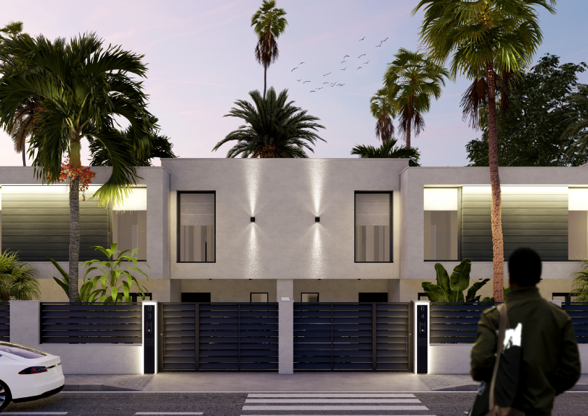 Oasis-Los-Pinos-II-Inalgra-Huercal-de-Almería-3 - MiraCasa Modern two-story house with a gated front yard, palm trees, and a person walking by on the street in the foreground.